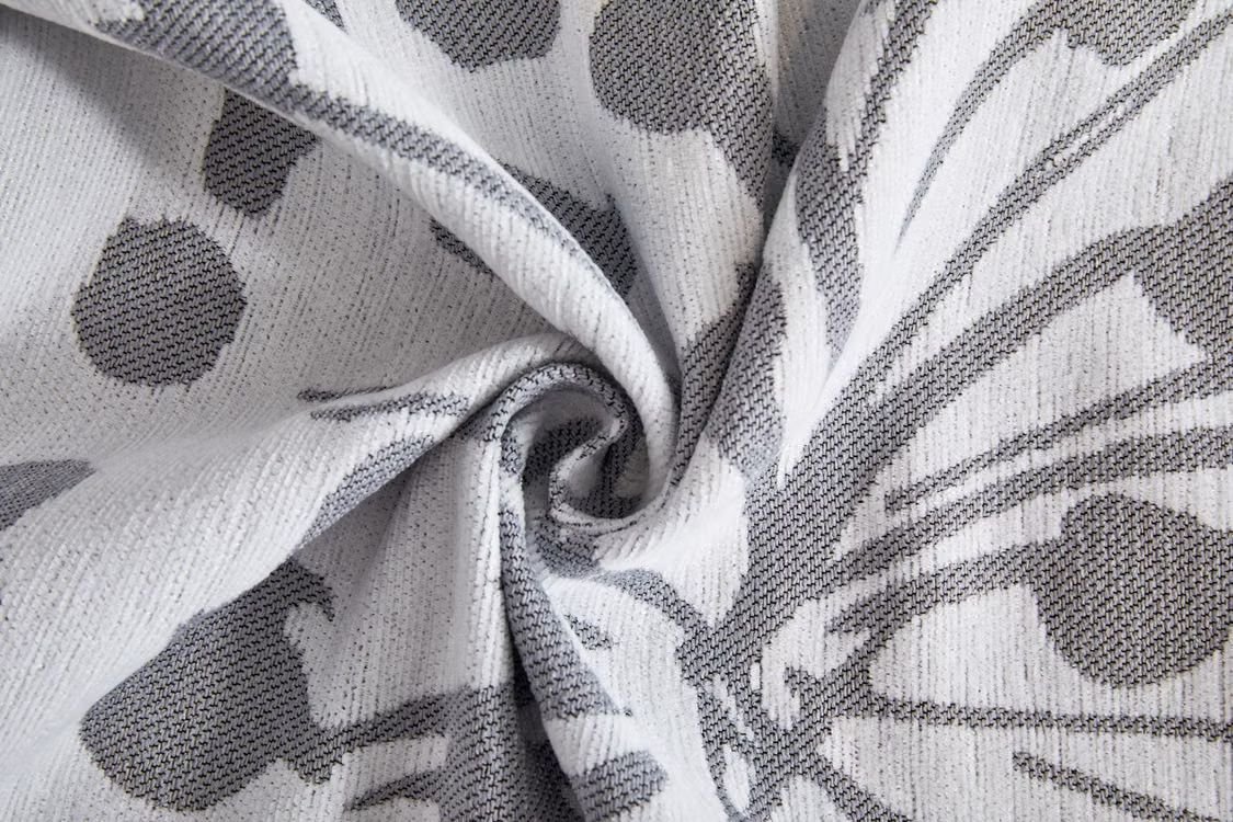Grey swirl-pattern fabric detail used for commercial upholstery